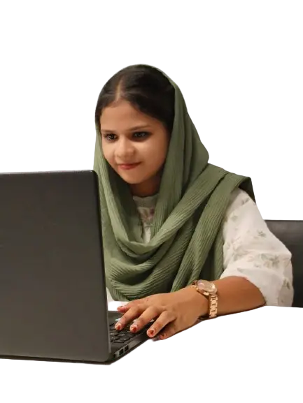 A professional woman, representing the Best Digital Marketing Freelancer in Dubai, sits focused at a white desk wearing a sage green headscarf and patterned white outfit, her hands positioned to type on a black laptop keyboard.